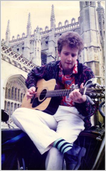 Patrick playing his guitar outside King's college